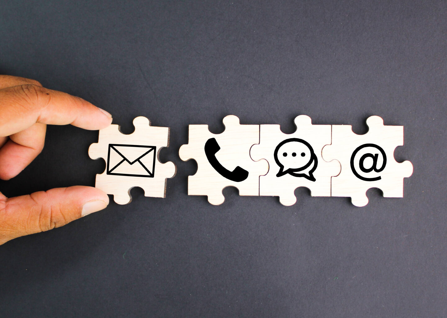 Contact options illustrated as puzzle pieces